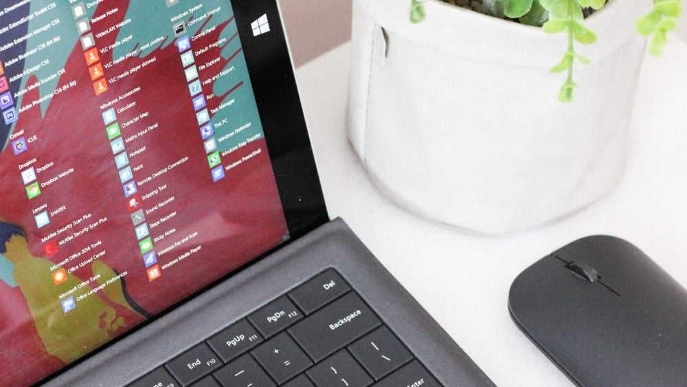 black laptop computer beside black wireless mouse