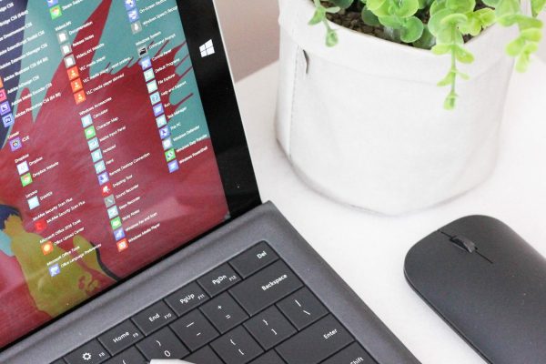 black laptop computer beside black wireless mouse